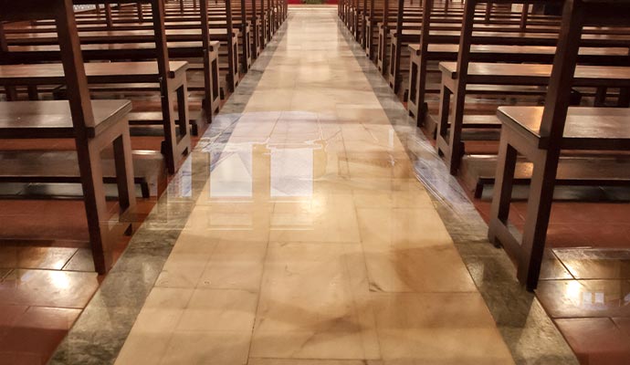 Interior of a church with a polished marble aisle