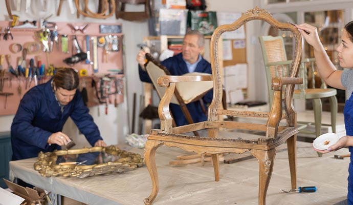 professional worker restoring Furniture