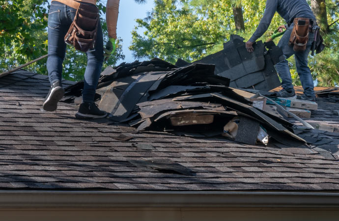 professional team restoring a storm damaged roof