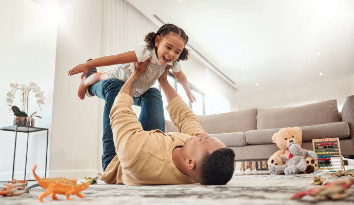 A person playing with a kid