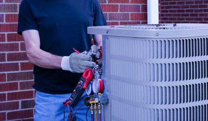 A professional restoring an ac