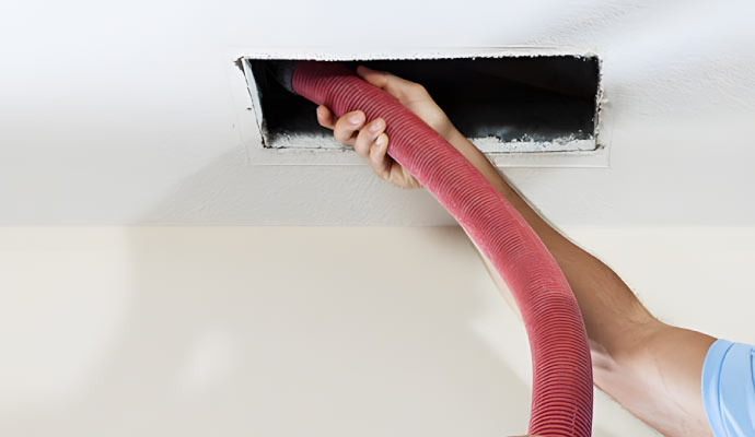 Expert removing soot form duct