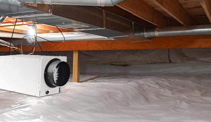 Installed dehumidifier system in a crawl space