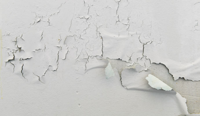 Cracked and peeling paint on a wall