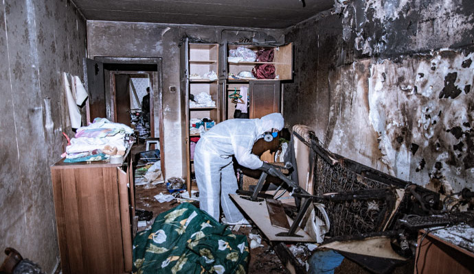 Professional restoring fire damaged room