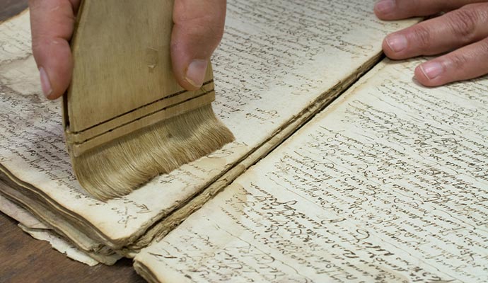 Expert restoring water damaged documents.