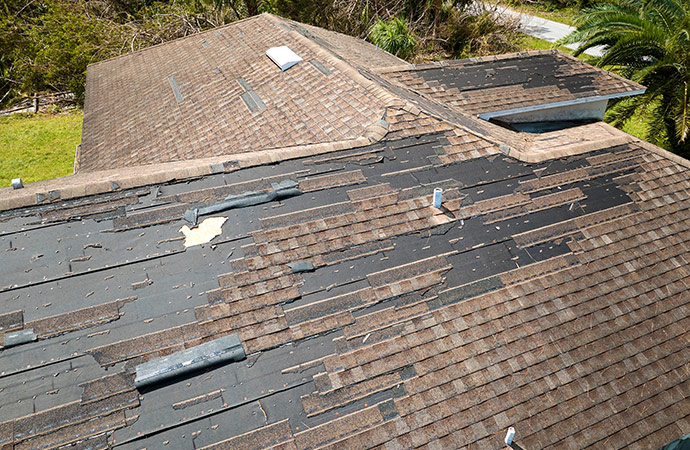 a damaged roof of a house