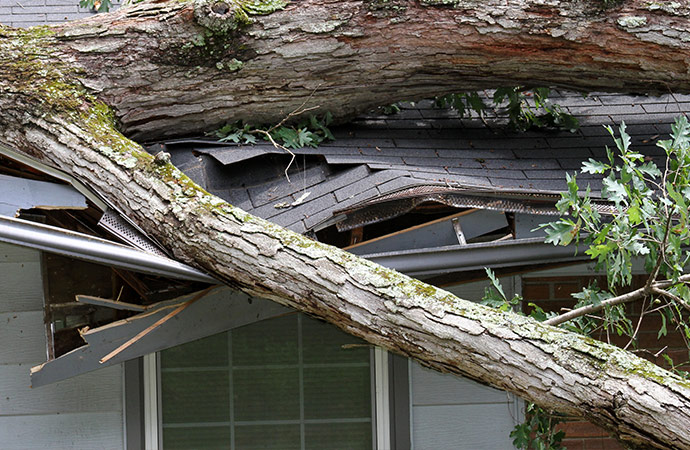 a house damaged by the aftermath of a heavy storm