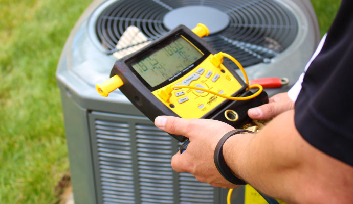 professional worker inspecting HVAC unit