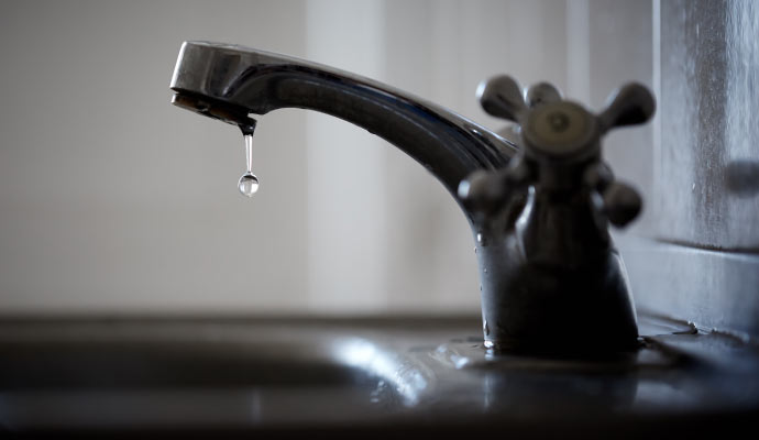 Leaky faucet with water drop